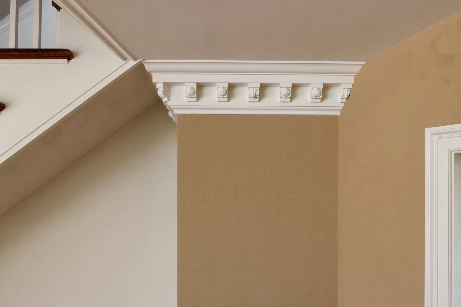 Crown moulding and baseboard detail in a suburban home interior