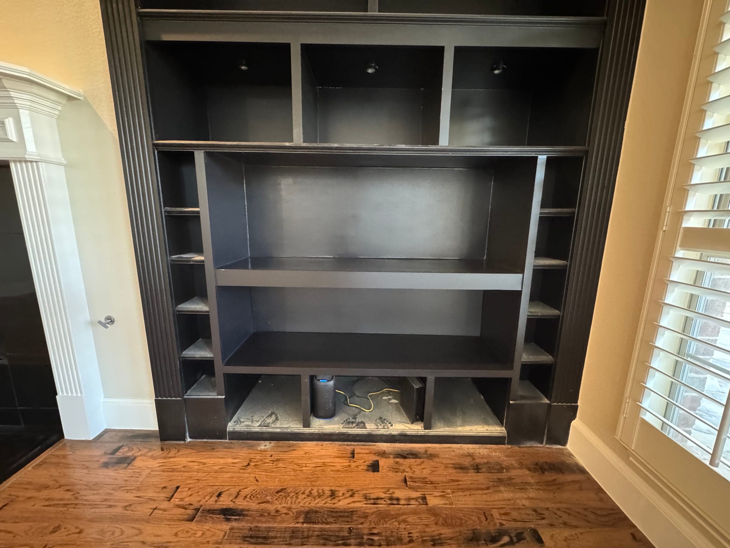 Finished built-in entertainment center by Chilton Home Services